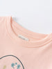 Close-up of a peach t-shirt neckline with floral design detail Printed Long Sleeve Tee - Dove Girls