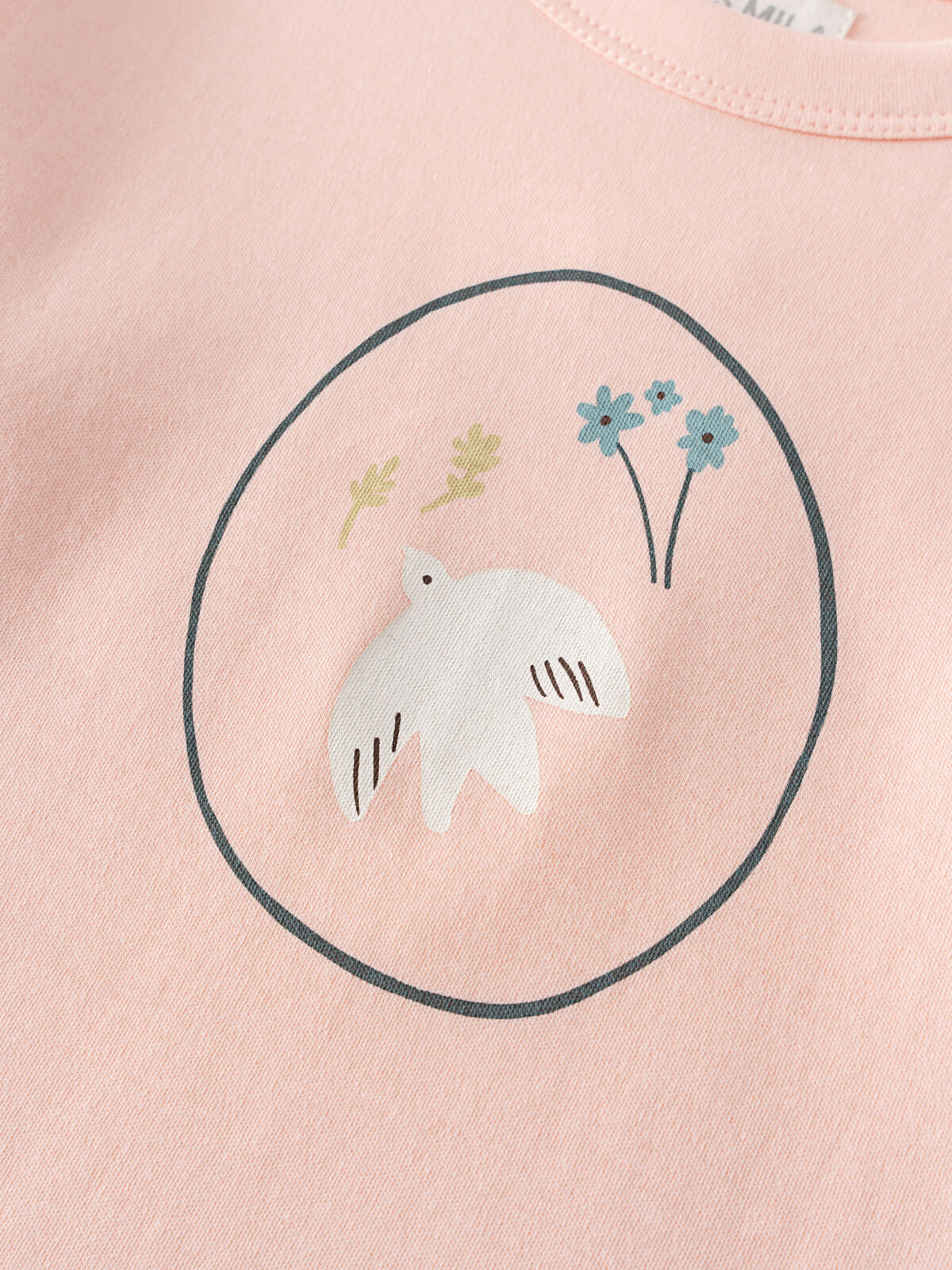Close-up of a pink shirt with an elephant and flower print in a circle Printed Long Sleeve Tee - Dove Girls