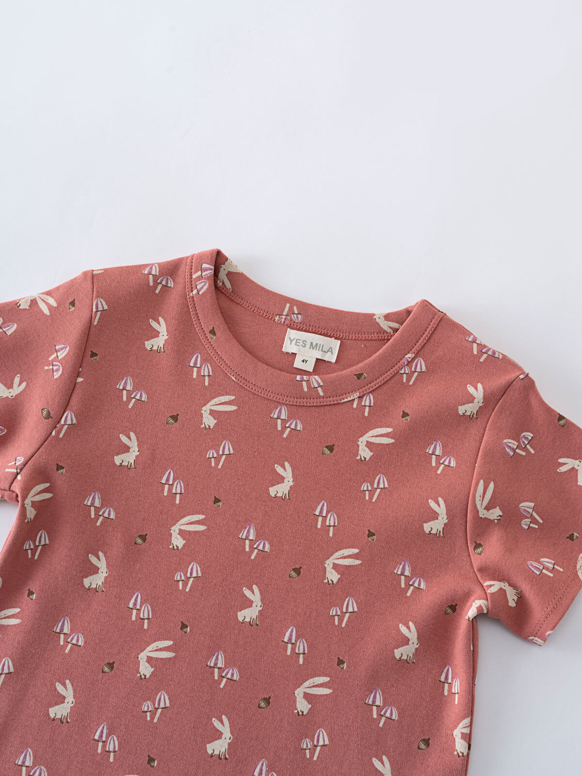 Close-up of a coral t-shirt with bunnies and mushrooms print Printed Short Sleeve Tee - Forest Gathering Rosehip Girls