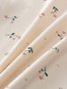 Close-up of cream fabric with pink flowers and green stems pattern Printed Short Sleeve Tee - Wild Meadow Ecru Girls