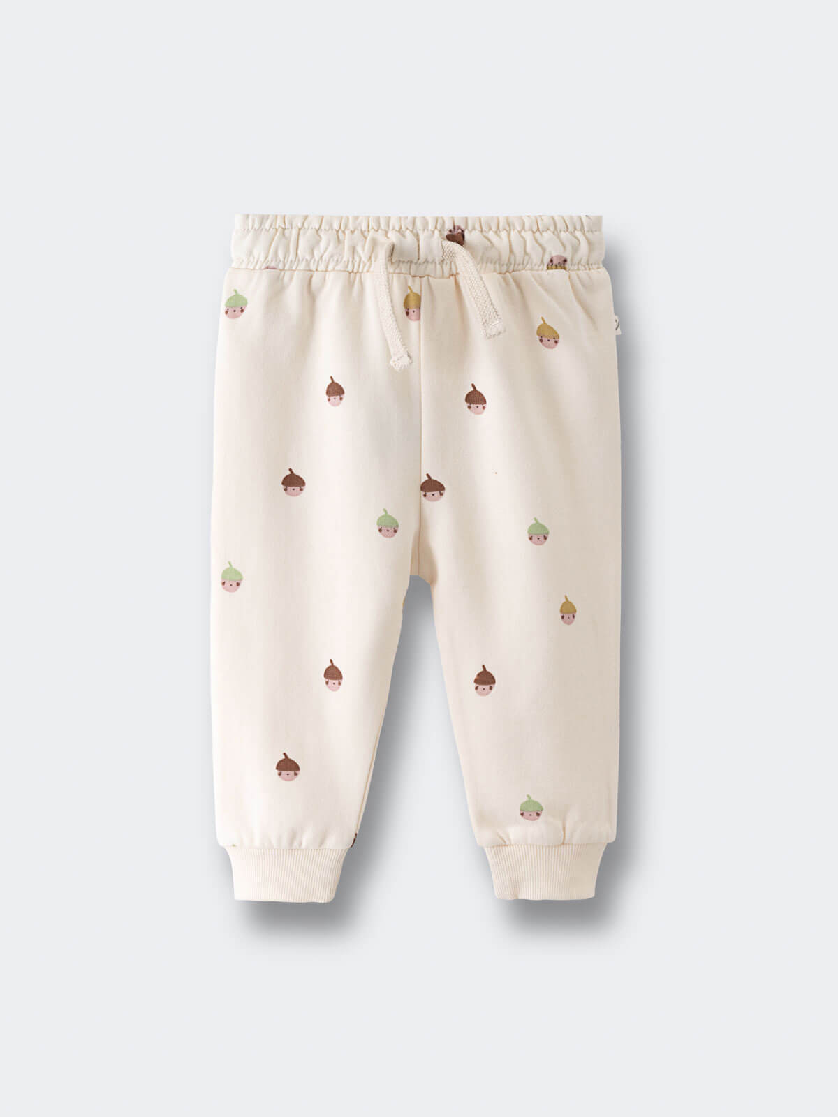Cream-colored sweatpants with small acorn face print pattern throughout Printed Sweatpants - Little Acorn Ecru Baby girl