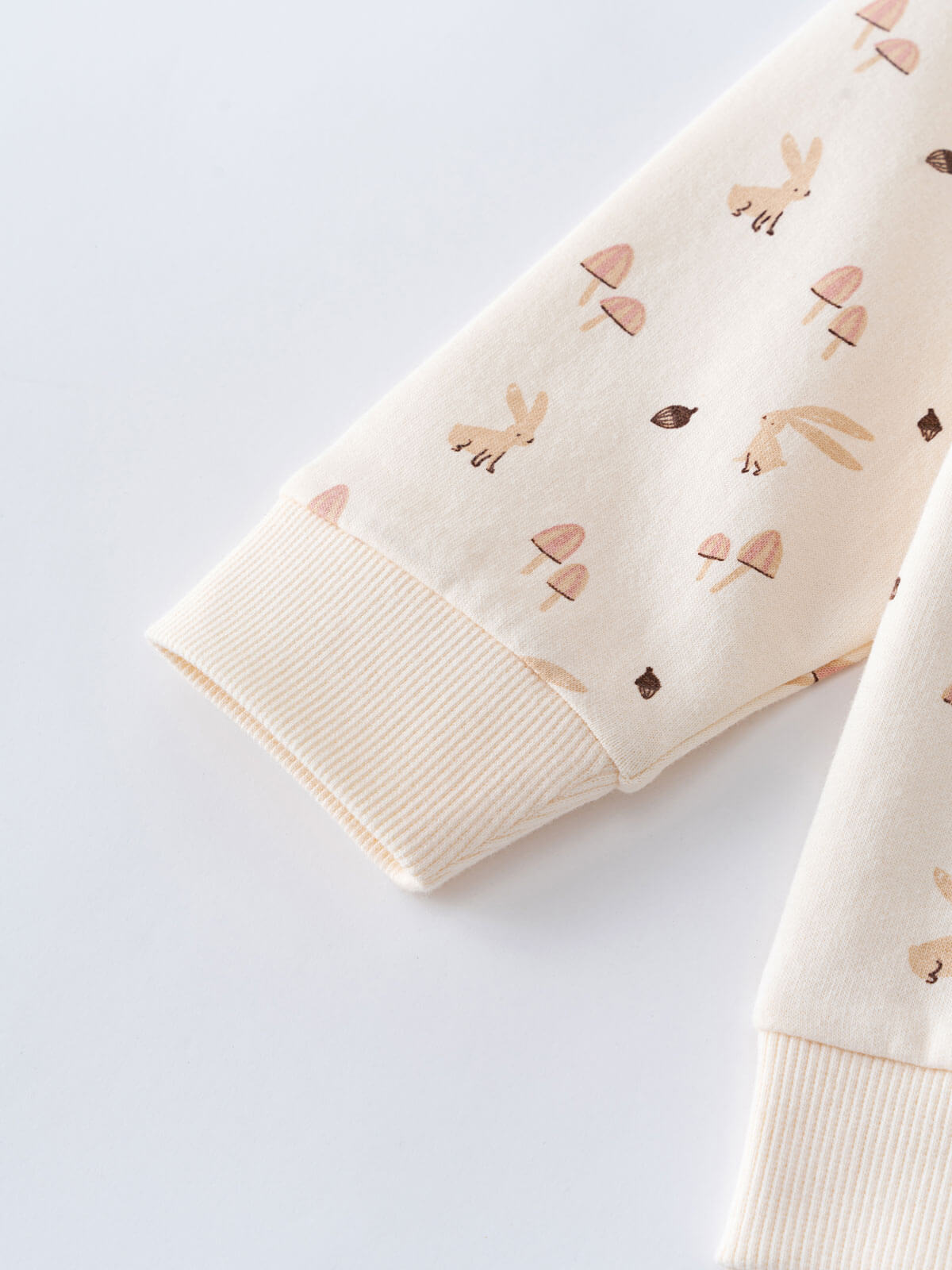 Close-up of cream sweatshirt sleeve with bunny and mushroom print, ribbed cuff Printed Sweatshirt - Forest Gathering Ecru Girls