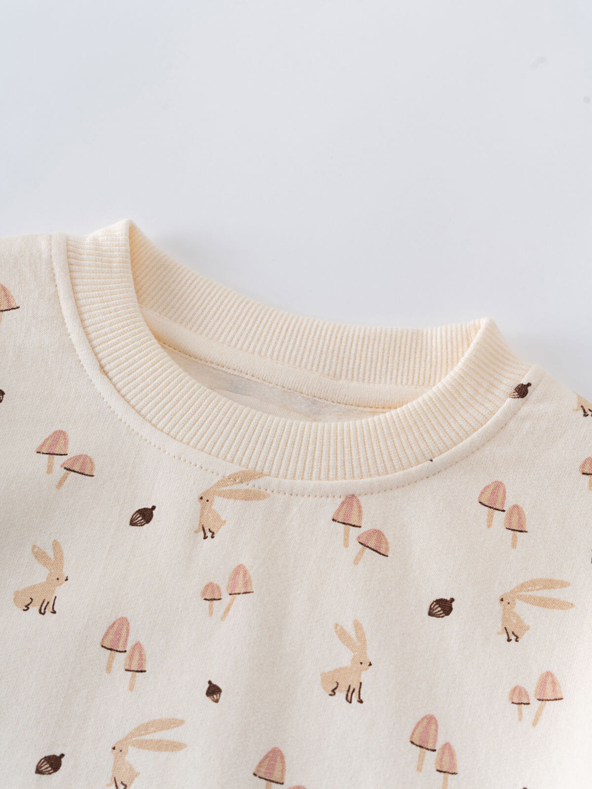 Close-up of cream sweatshirt collar with rabbits, mushrooms, and birds pattern Printed Sweatshirt - Forest Gathering Ecru Girls