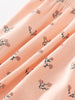 Close-up of peach fabric with small floral print pattern Printed Bloomers - Wildflower Bouquet Pink Baby girl