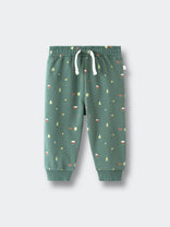 Green sweatpants with forest pattern and white drawstring on flat surface Printed Sweatpants - Mountain View Balsam Baby boy