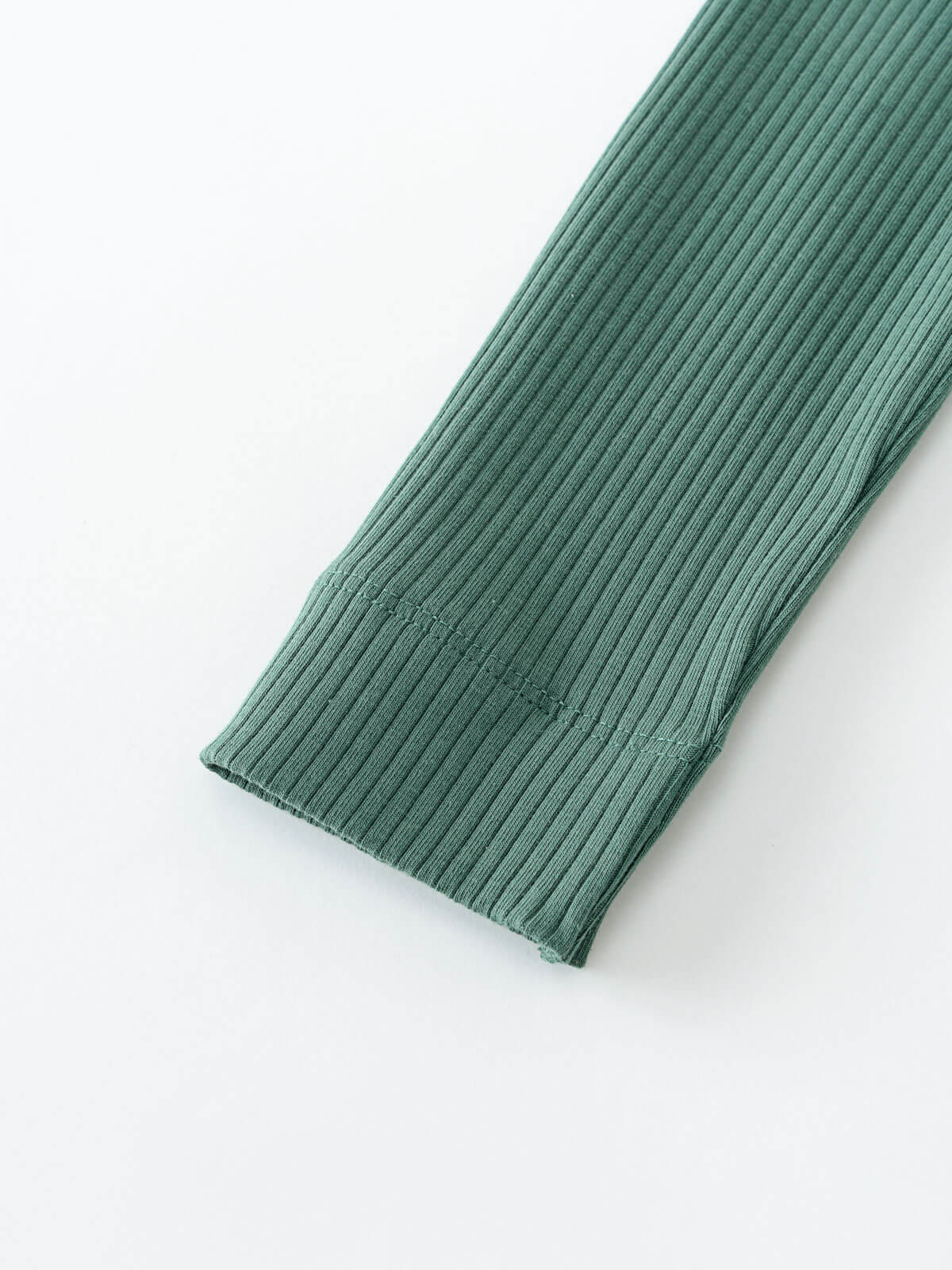 Close-up of ribbed sage green fabric leg cuff on white background Ribbed Leggings - Balsam Girls
