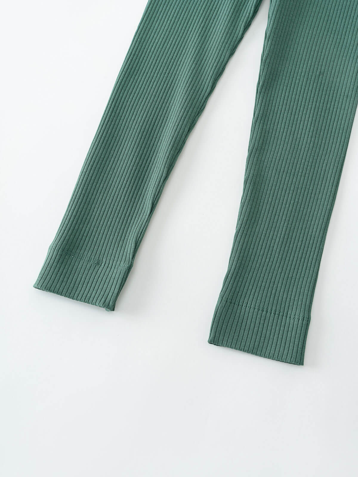 Close-up of ribbed green leggings showing textured fabric and hem detail Ribbed Leggings - Balsam Girls