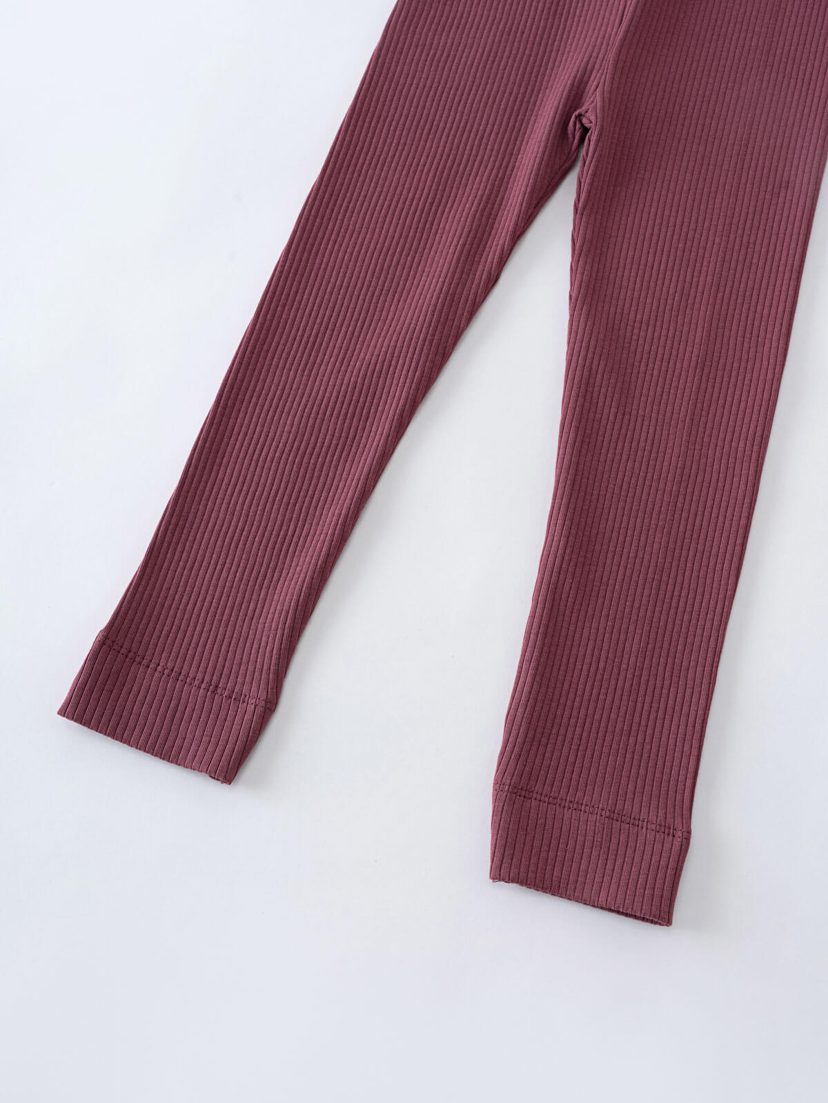 Close-up of ribbed leggings showing texture and hemmed leg openings in mauve Ribbed Leggings - Plum Jam Girls