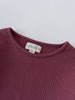 Close-up of a plum-colored ribbed long sleeve shirt neckline with label Ribbed Long Sleeve Tee - Plum Jam Girls