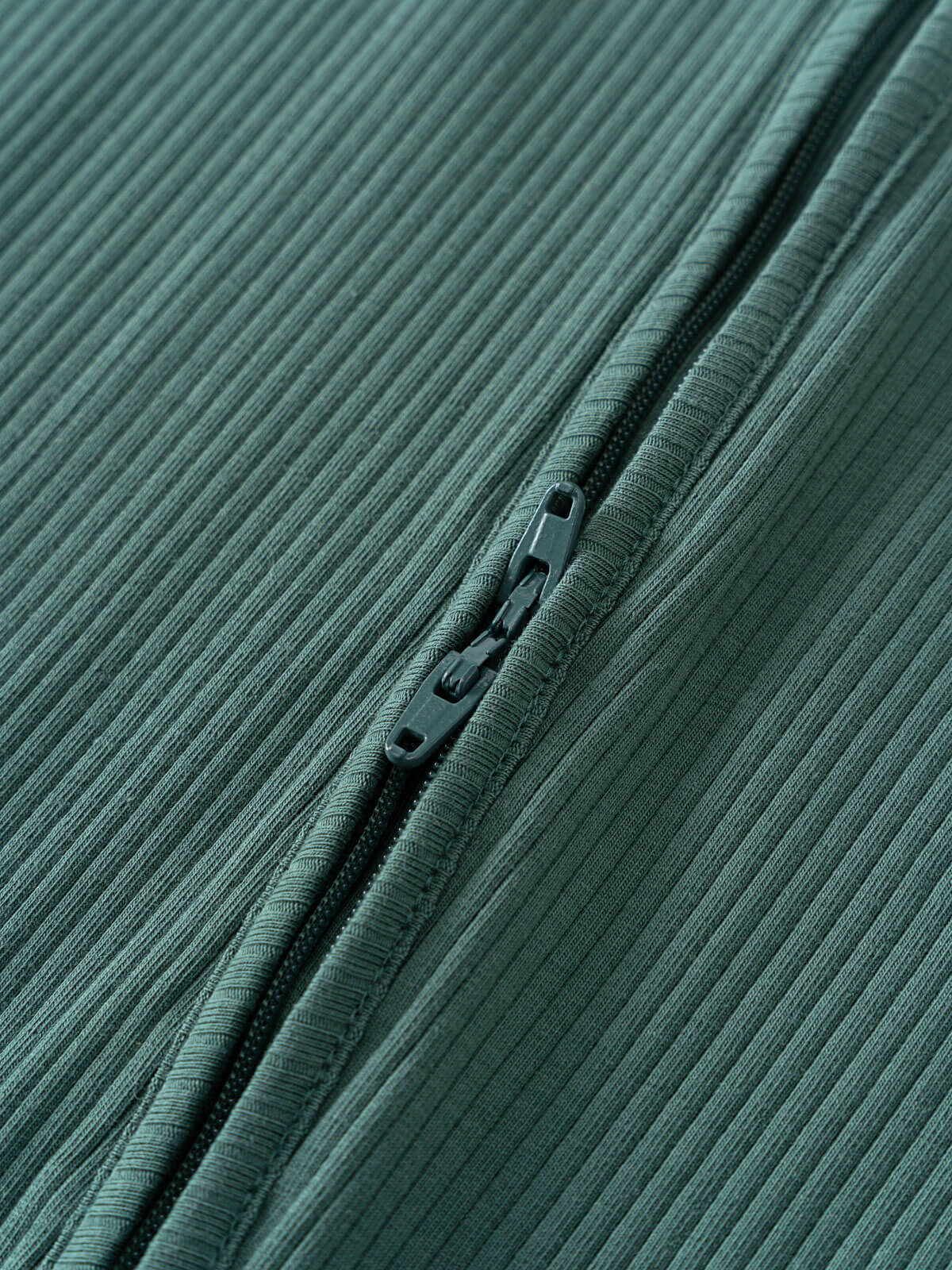 Close-up of a teal ribbed fabric with a zipper detail Ribbed Long Sleeve One Piece - Balsam Baby boy