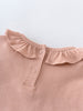 Close-up of a blush pink knit collar with ruffle detail and buttons Ruffle Long Sleeve Bodysuit - Blush Baby girl