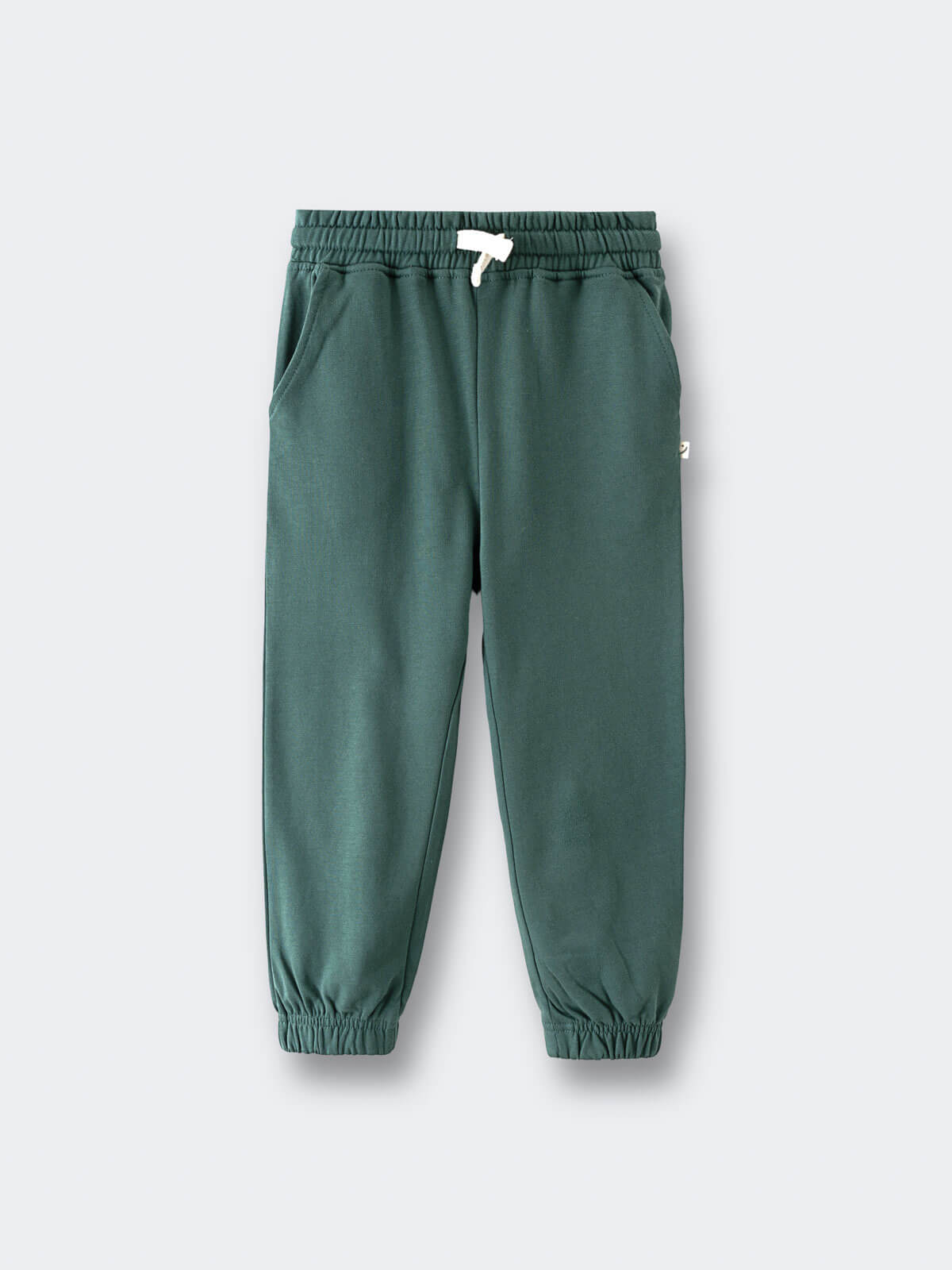 Green sweatpants with elastic cuffs and white drawstring on gray background Sweatpants - Balsam Boys