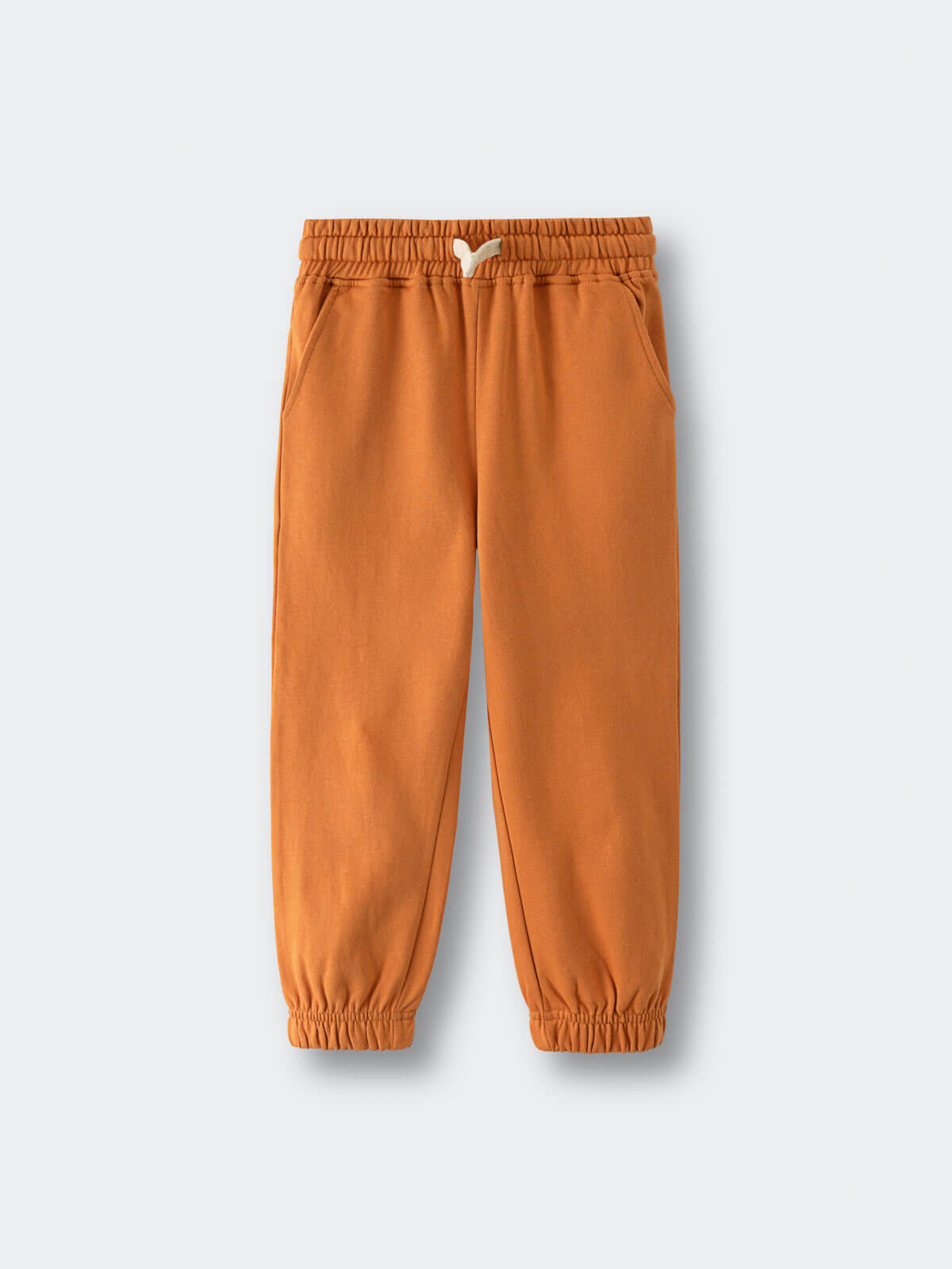 Orange sweatpants with elastic waistband and cuffs on white background Sweatpants - Pumpkin Boys