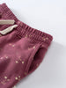 Close-up of burgundy pants with floral print and elastic waistband with drawstring Sweatpants - Wild Meadow Plum Jam Girls