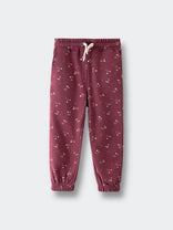 Burgundy joggers with small floral print and elastic cuffs on light background Sweatpants - Wild Meadow Plum Jam Girls