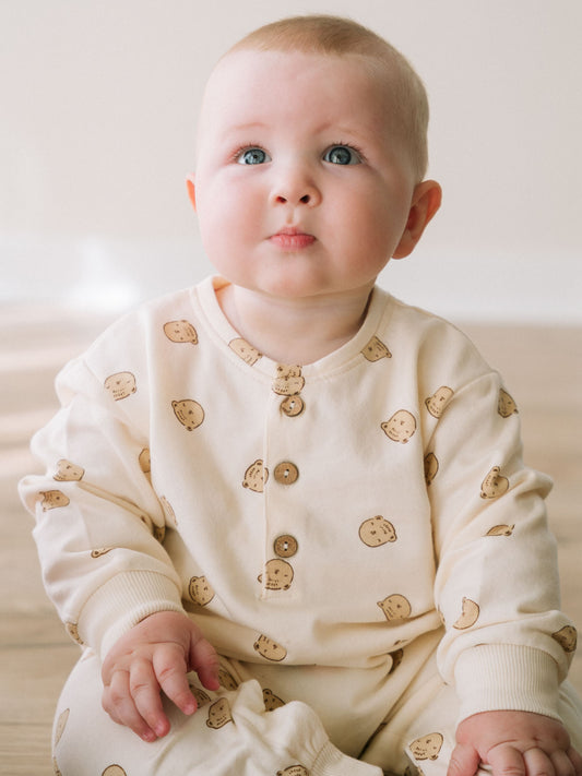 Baby in cream onesie with bear print looking upward Sweatshirt Onesie - Cosy Bear Ecru Baby boy