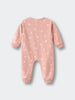 Pink baby onesie with white rabbit pattern and ribbed cuffs laid flat Sweatshirt Onesie - Meadow Friends Blush Baby girl