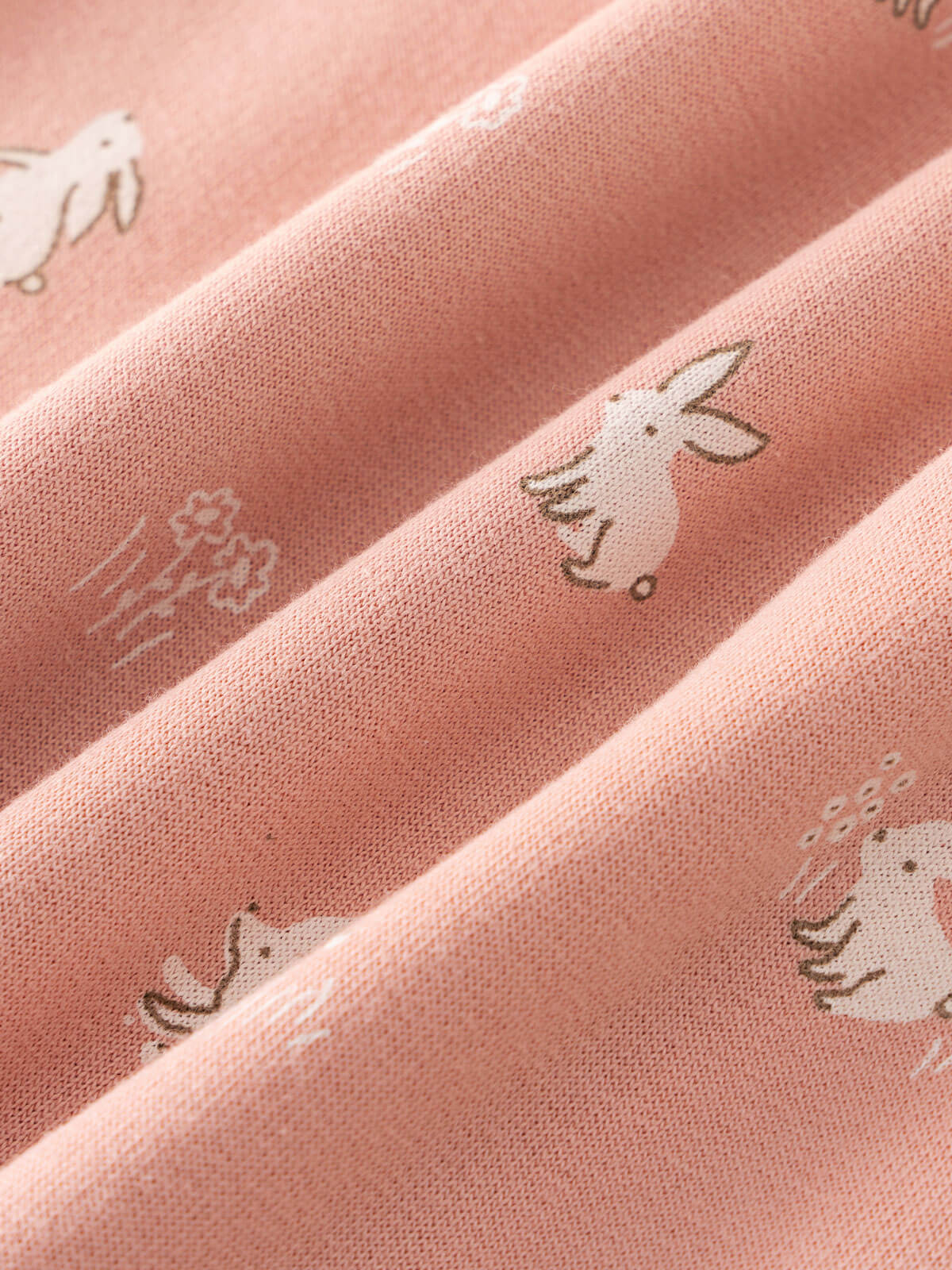 Close-up of pink fabric with small white rabbit and hedgehog prints Sweatshirt Onesie - Meadow Friends Blush Baby girl