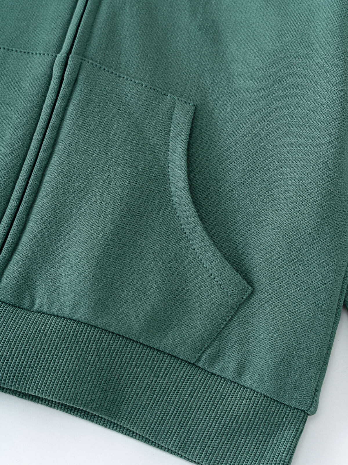 Close-up of a teal hoodie pocket and ribbed hem detail Zip Hoodie - Balsam Boys