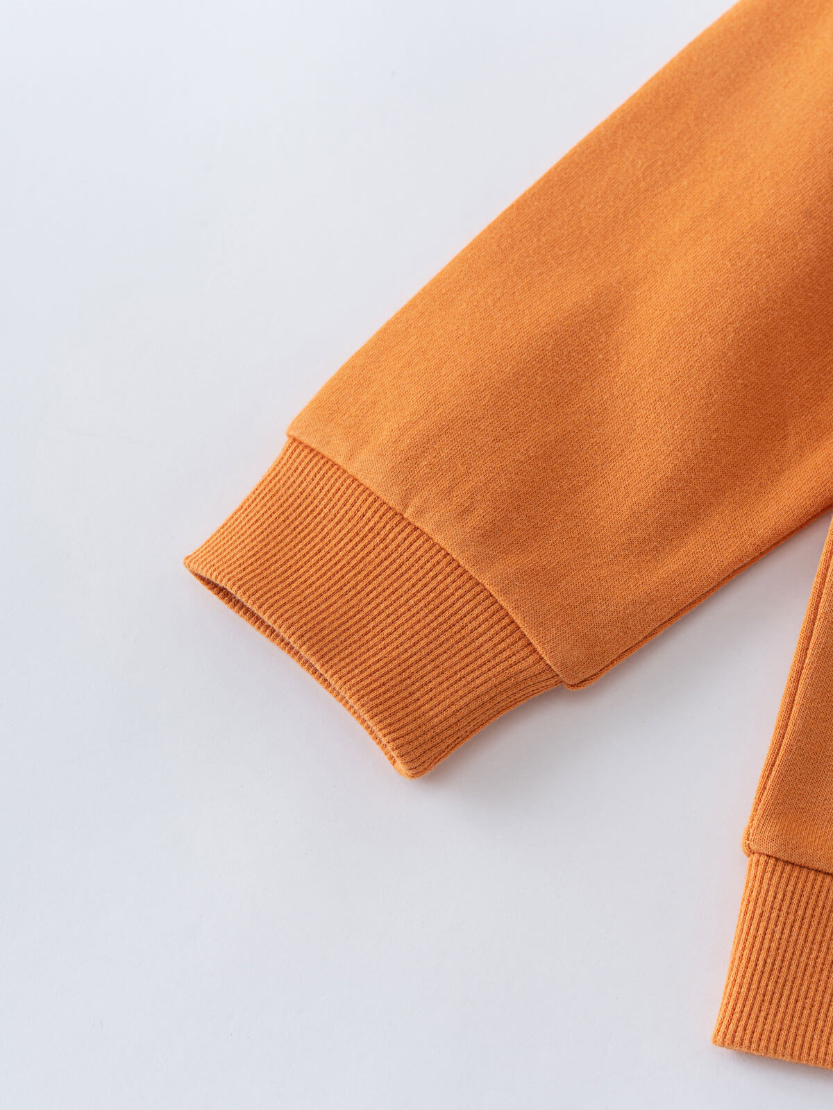 Close-up of orange sweatshirt sleeve with ribbed cuff detail Zip Hoodie - Pumpkin Boys