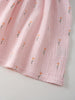 Pink textured fabric with floral patterns on a light gray background Amara Dress - Poppy Field Girls