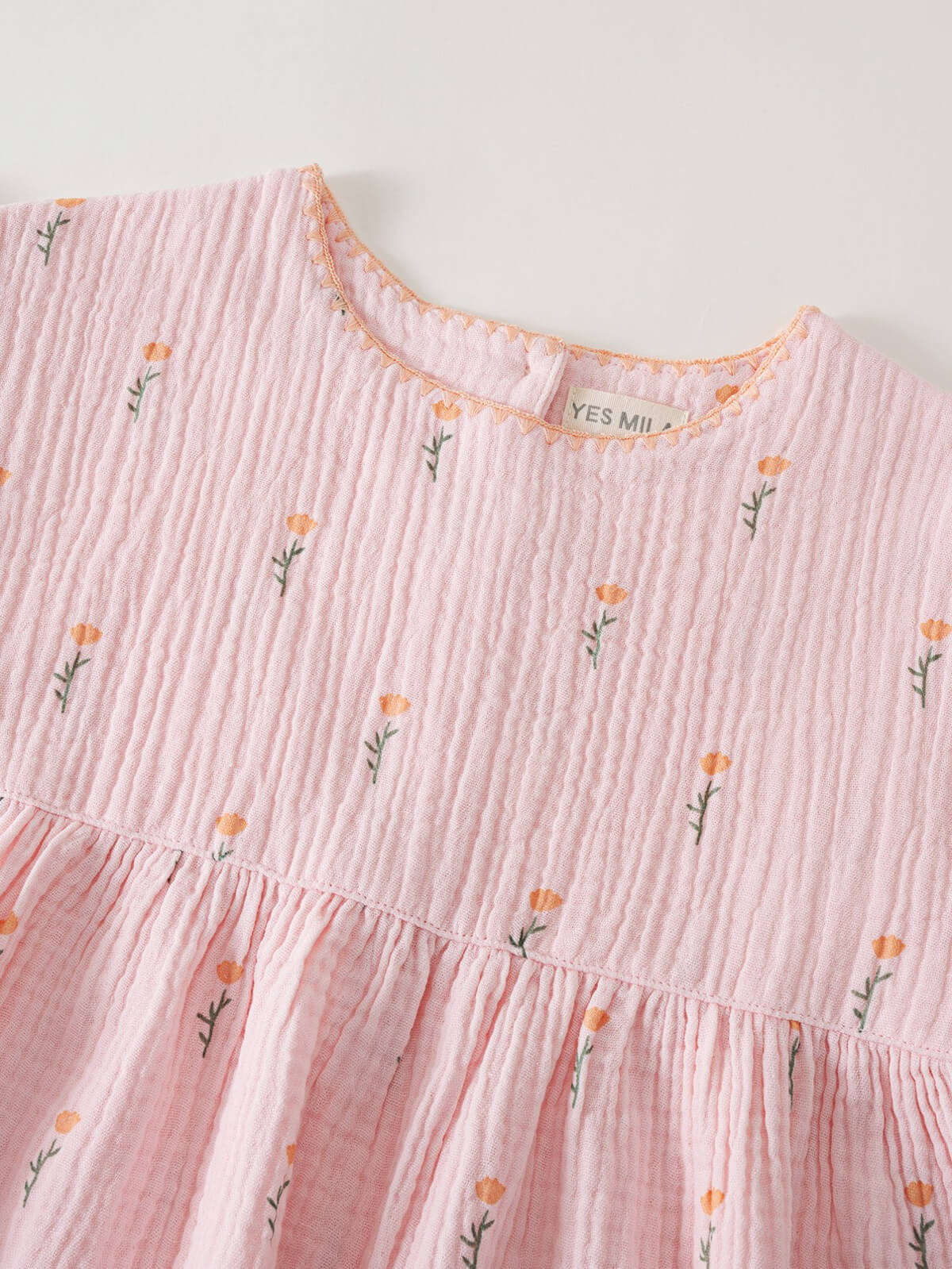 Pink dress with floral patterns on a white background Amara Dress - Poppy Field Girls