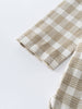 Folded beige and white checkered Baby shirt on a light gray background Baby Check Shirt - Woven Check Baby boy