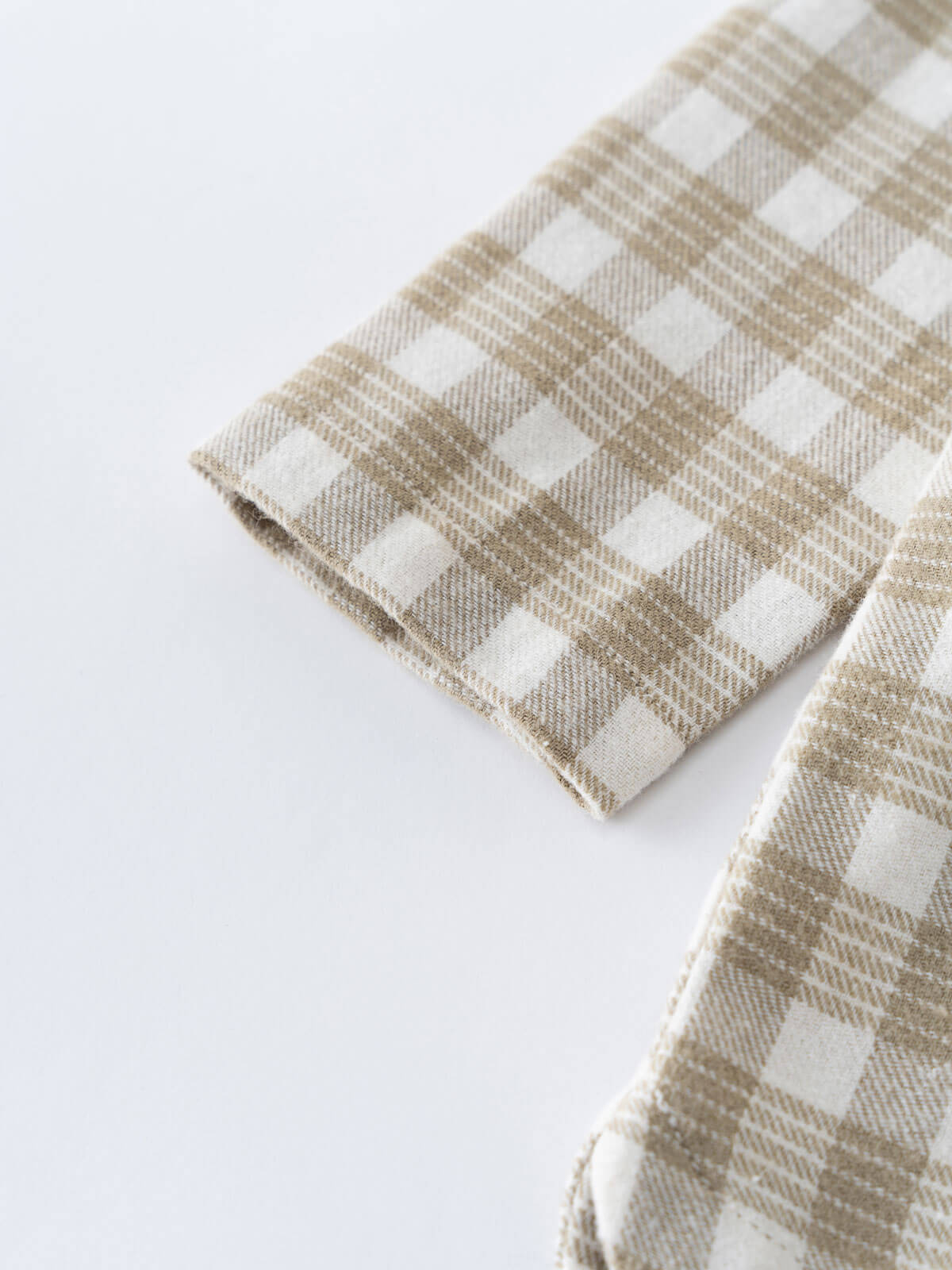 Folded beige and white checkered Baby shirt on a light gray background Baby Check Shirt - Woven Check Baby boy