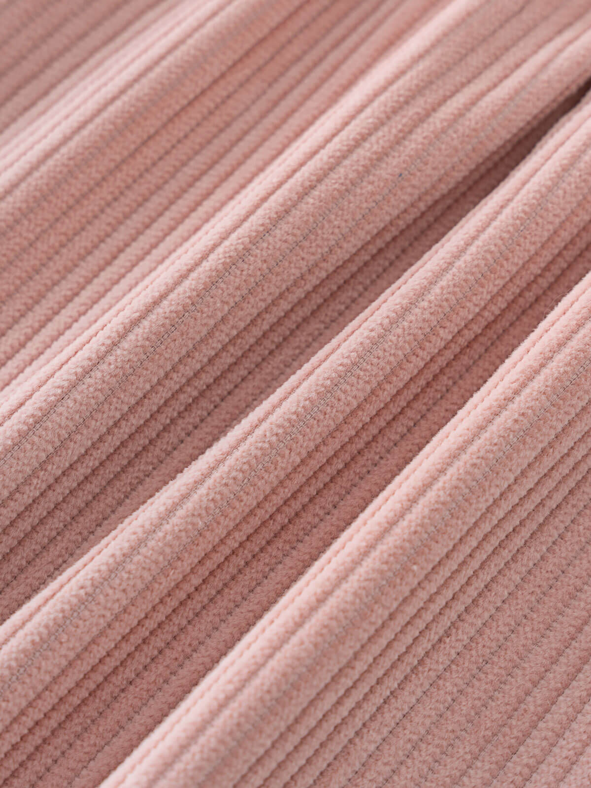 Close-up of corduroy pink fabric texture