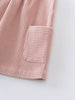 Pink corduroy dress with a pocket on a white background