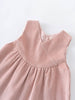 Pink corduroy dress on a white background