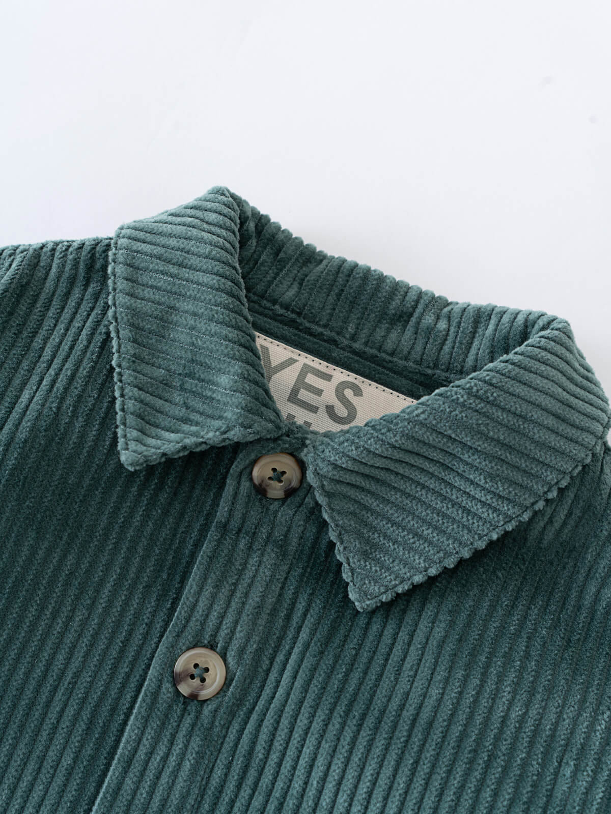 Close-up of a green corduroy jacket with collar and buttons on a white background Baby Corduroy Jacket - Balsam Baby boy