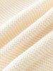 Close-up of beige knitted cotton fabric texture