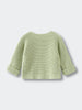 Light green knitted cotton cardigan on a light gray background