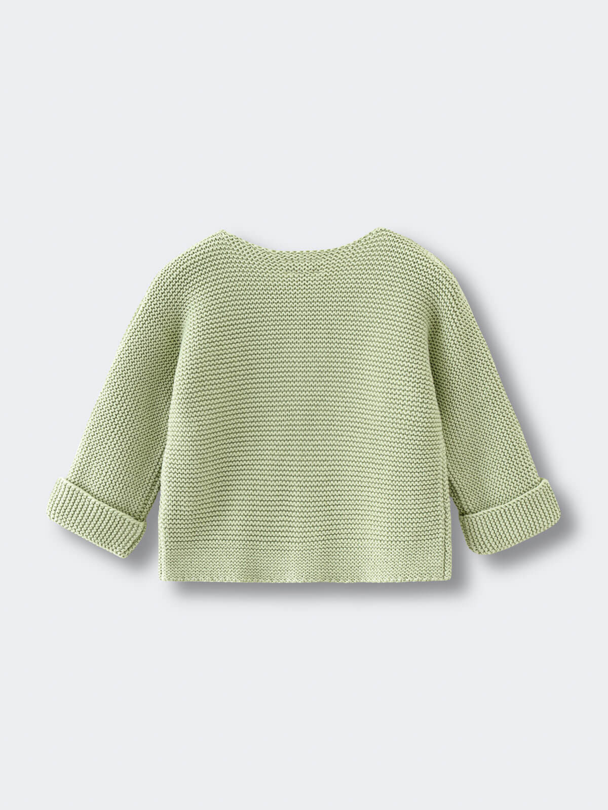 Light green knitted cotton cardigan on a light gray background
