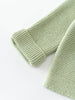 Green knitted cotton cardigan on a white background