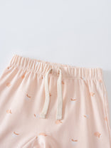 Close-up of pale pink shorts with apple print and cream drawstring Baby Jersey Shorts - Apples Baby girl