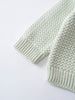 Close-up of a pale green knitted sweater sleeve with ribbed cuffs Baby Knit Jumper - Mint Baby boy
