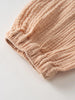 Close-up of beige ribbed fabric with gathered elastic waistband detail Baby Muslin Pants - Sand Baby boy