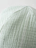 Close-up of a pale green striped fabric hat with ribbed texture Baby Muslin Sun Hat - Green Stripe Baby boy