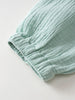 Close-up of mint green ribbed fabric with elastic gathered cuffs Baby Muslin Pants - Calla Green Baby boy