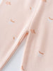 Close-up of pale pink fabric with small orange apple print pattern Baby Printed Leggings - Apples Baby girl