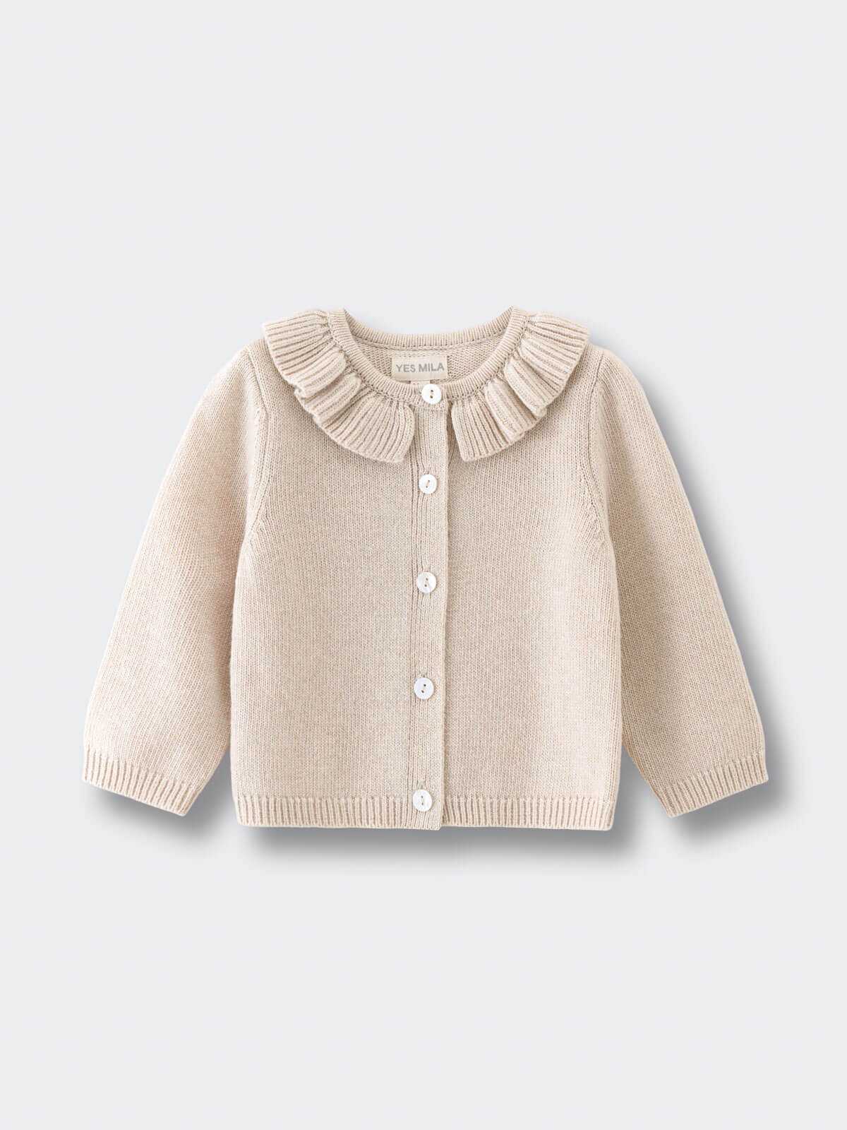 Beige cardigan with ruffled collar on a light gray background Baby Ruffle Cardigan - Ecru Baby girl