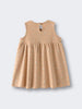 Beige sleeveless dress with small floral print pattern laid flat Baby Sleeveless Jersey Dress- Floral Bloom Baby girl