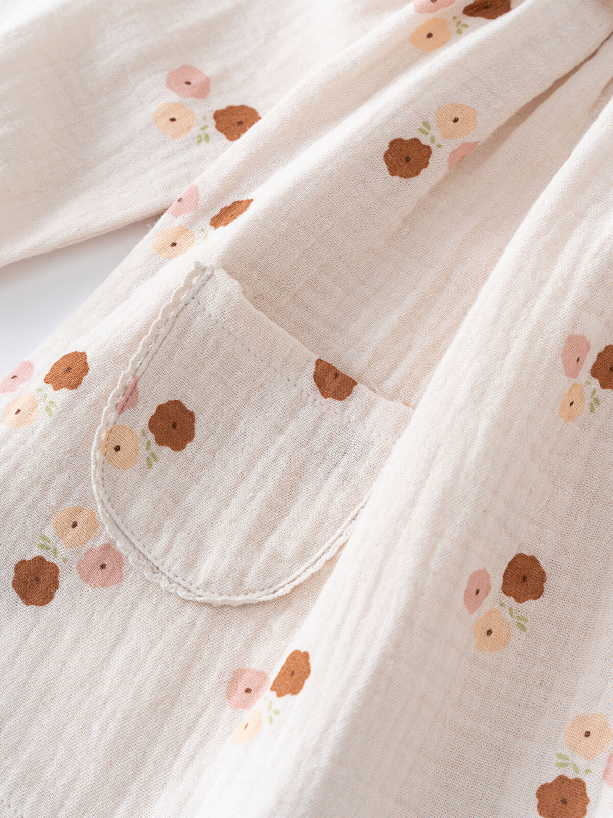 Floral patterned dress with a pocket on a light background