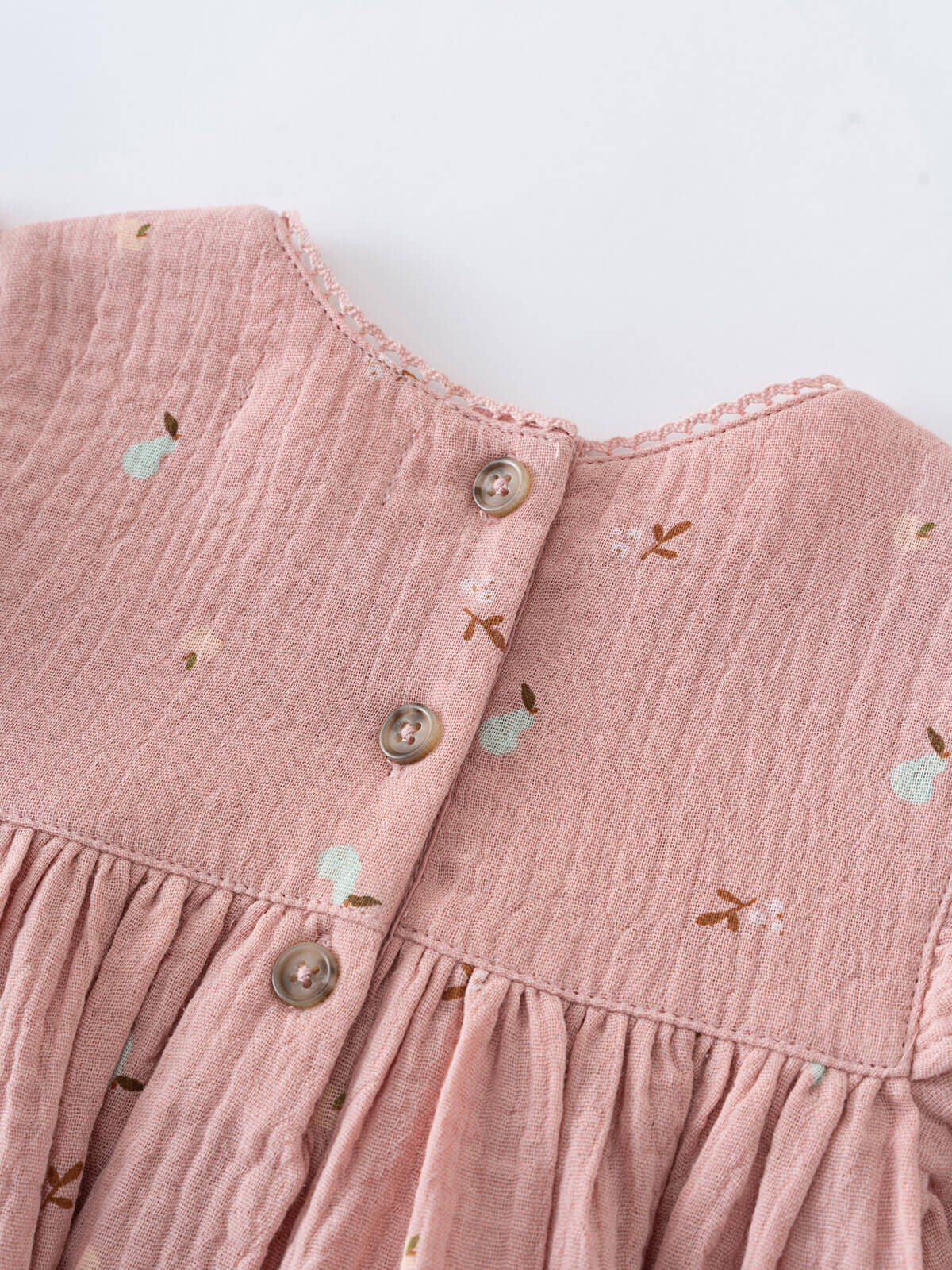 Close-up of a pink baby dress with floral patterns on a white background Baby Woven Dress - Autumn Harvest Rosehip Baby girl