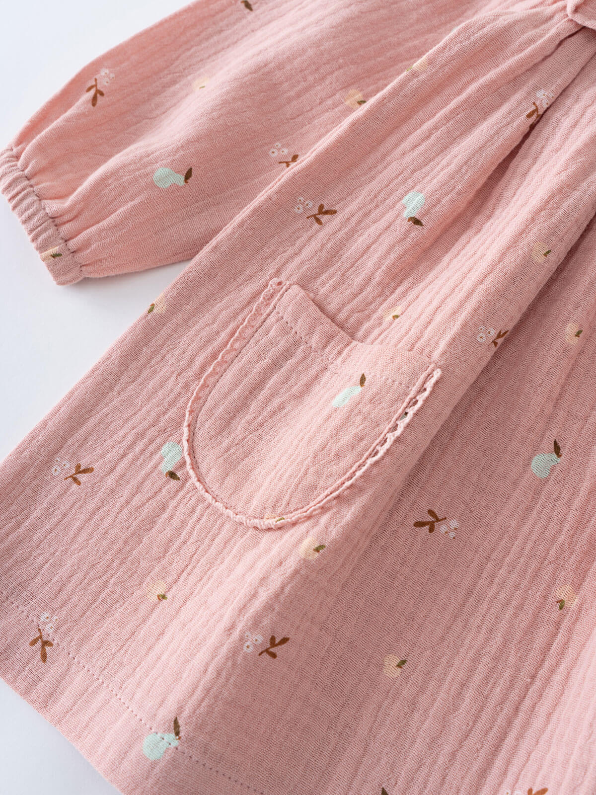 Pink baby dress with small embroidered designs on pockets on a white background Baby Woven Dress - Autumn Harvest Rosehip Baby girl