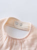 Close-up of a pink garment with a collar on a light gray background Bandana Bibs 3 Pack - Petal Paws Baby girl
