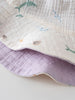 Close-up of white fabric with dolphin and sea life pattern, lavender reverse side Bucket Hat - Dolphin Fun Girls