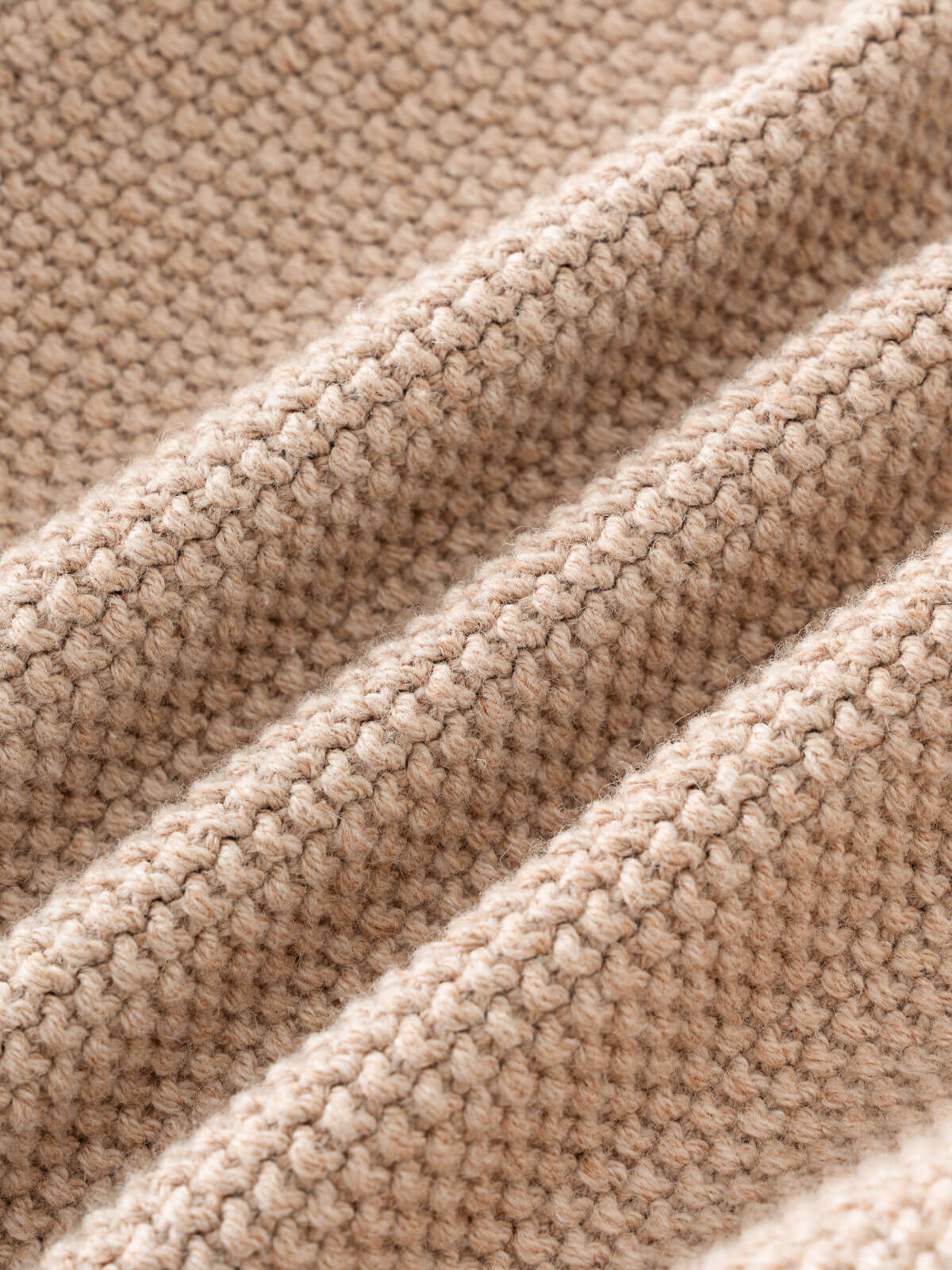 Close-up of beige textured fabric Cable Knit Jumper - Wicker Boys